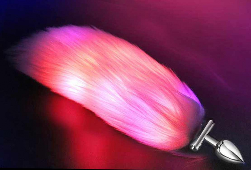 Втулка анальная "Glow tail" металлическая светящаяся с розовым хвостом
